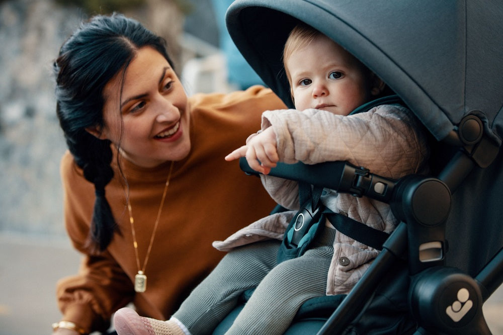 Family pushing baby in Gia Stroller