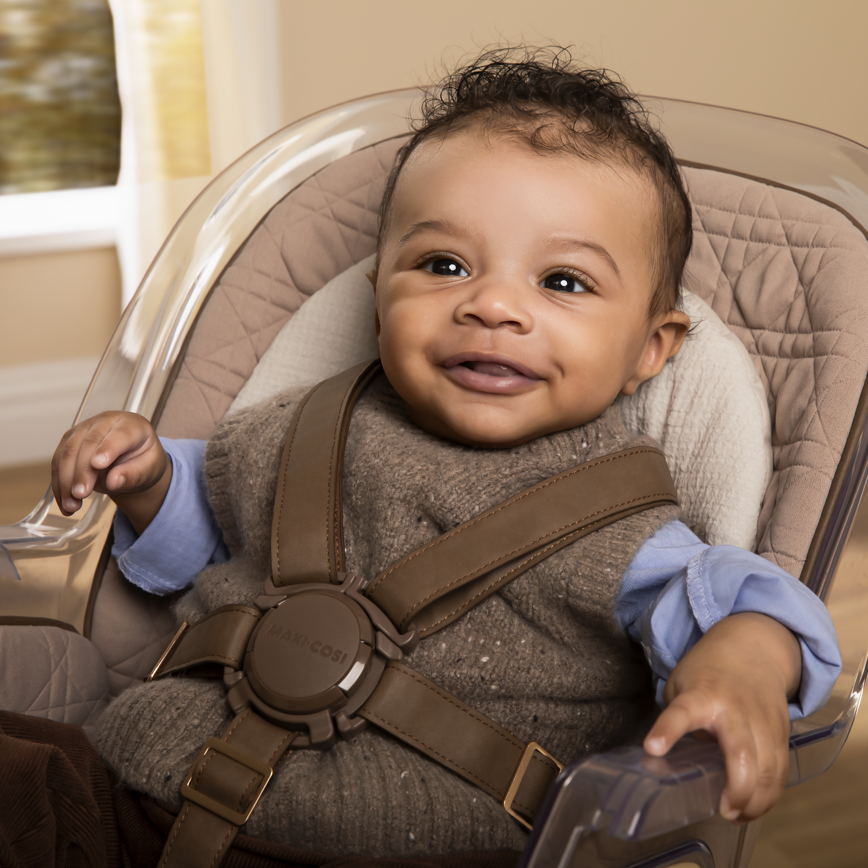 baby smiling in Kiskadee High Chair