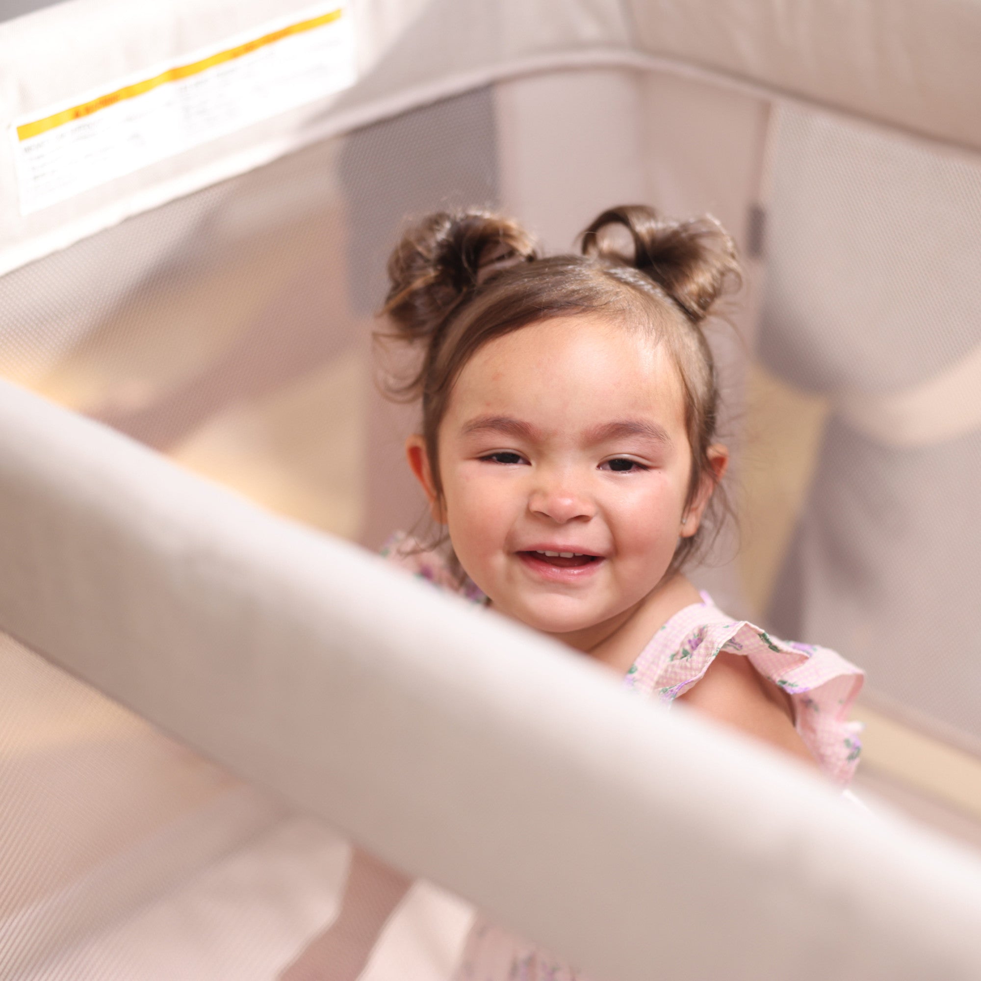 Swift Play Yard - toddler playing and smiling in play yard