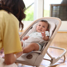 Kori 2-In-1 Rocker - baby in rocker with mother doting on him