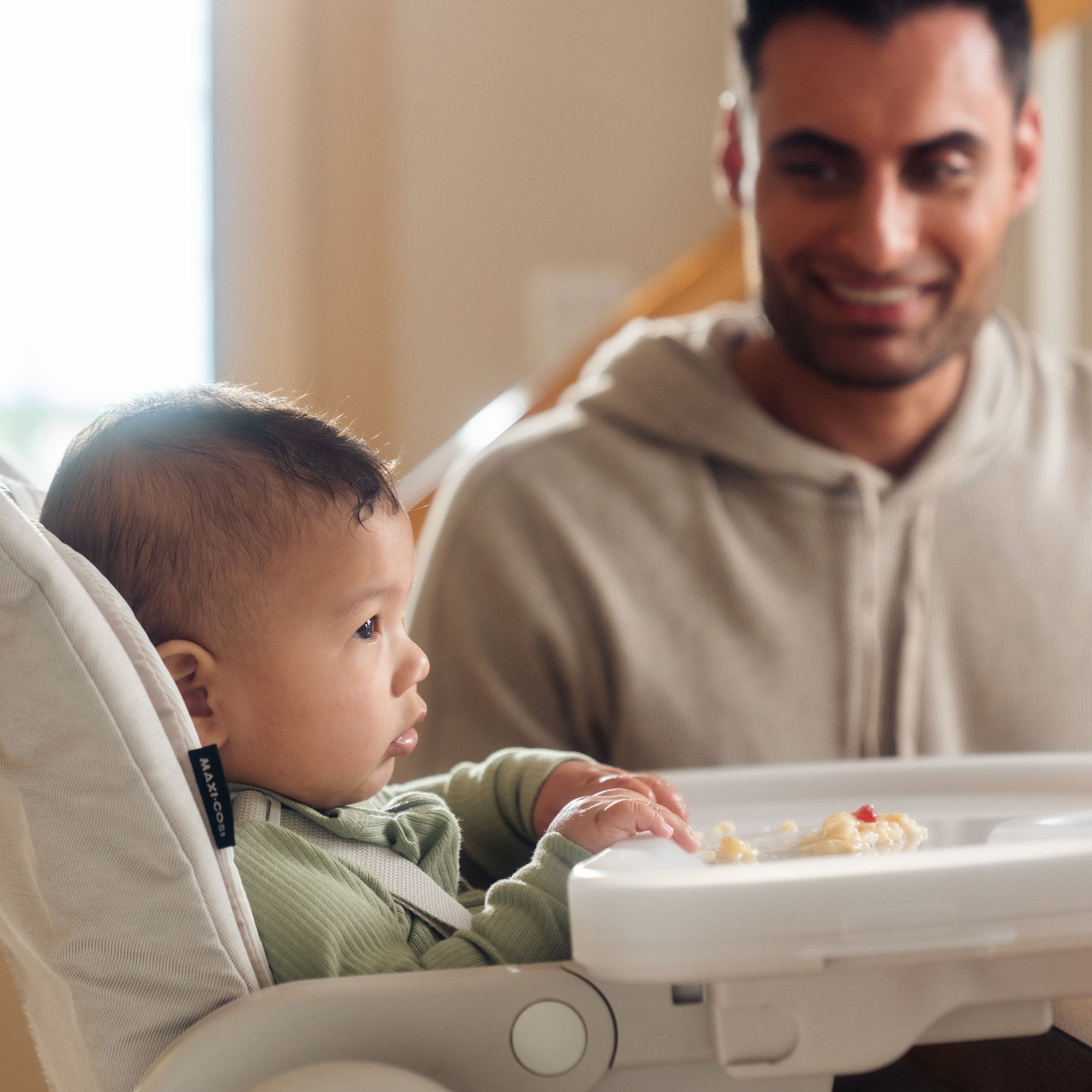 Minla 6-In-1 High Chair - baby eating with father looking on