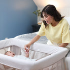 Swift Play Yard - baby in play yard with mother holding his hand