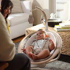 Cassia Swing - parents smiling at baby in swing