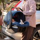 Mico™ Luxe Infant Car Seat - father carrying baby in car seat